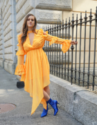 Black patent coat with yellow pants