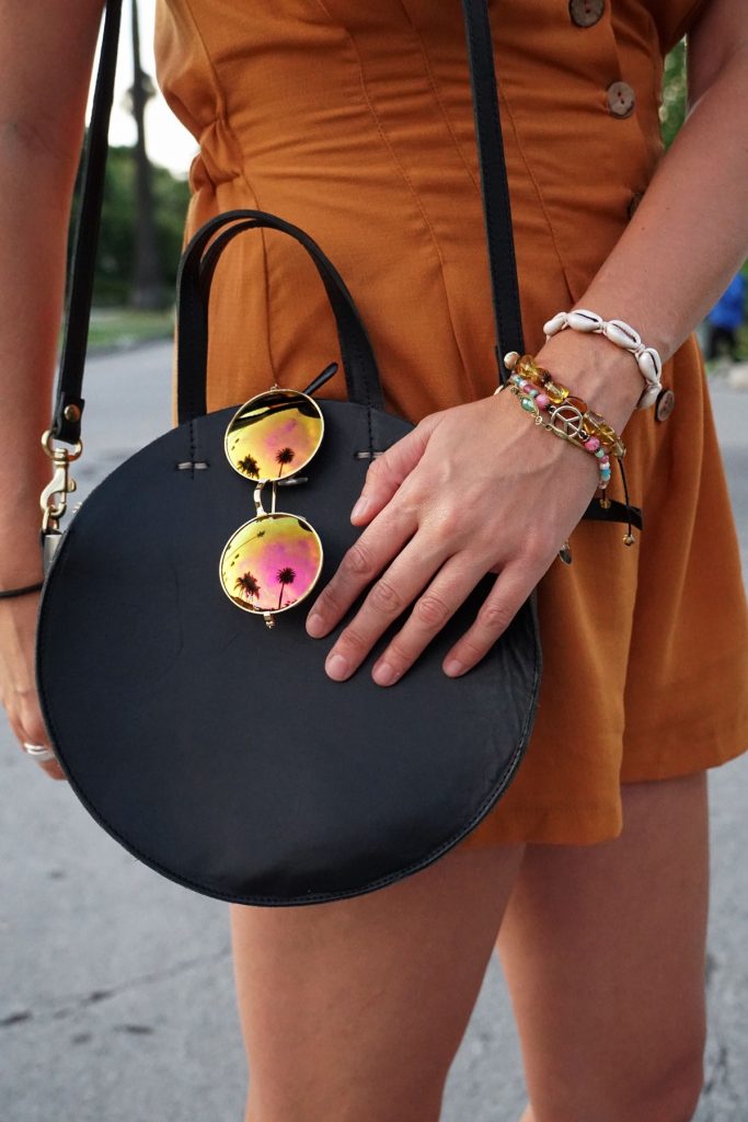 Andrea Steiner, fashion blogger from Strawberries 'n' Champagne based in Switzerland is wearing a romper, boots, bag and a self made hat.