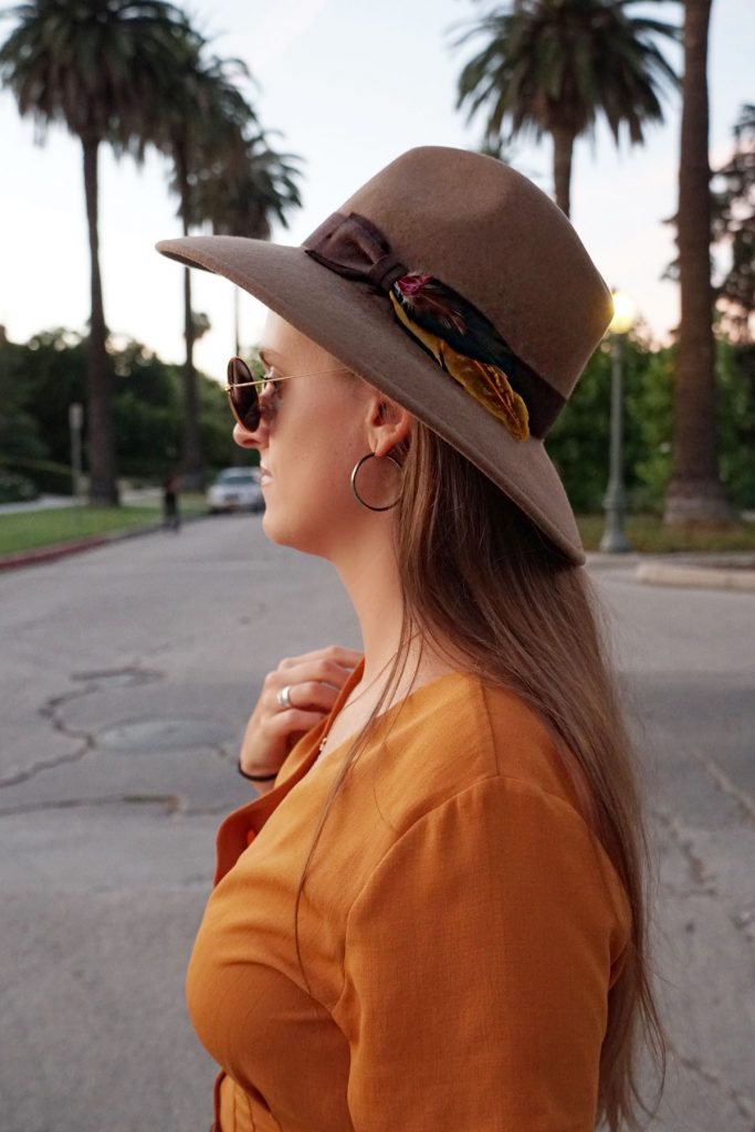 Andrea Steiner, fashion blogger from Strawberries 'n' Champagne based in Switzerland is wearing a romper, boots, bag and a self made hat.