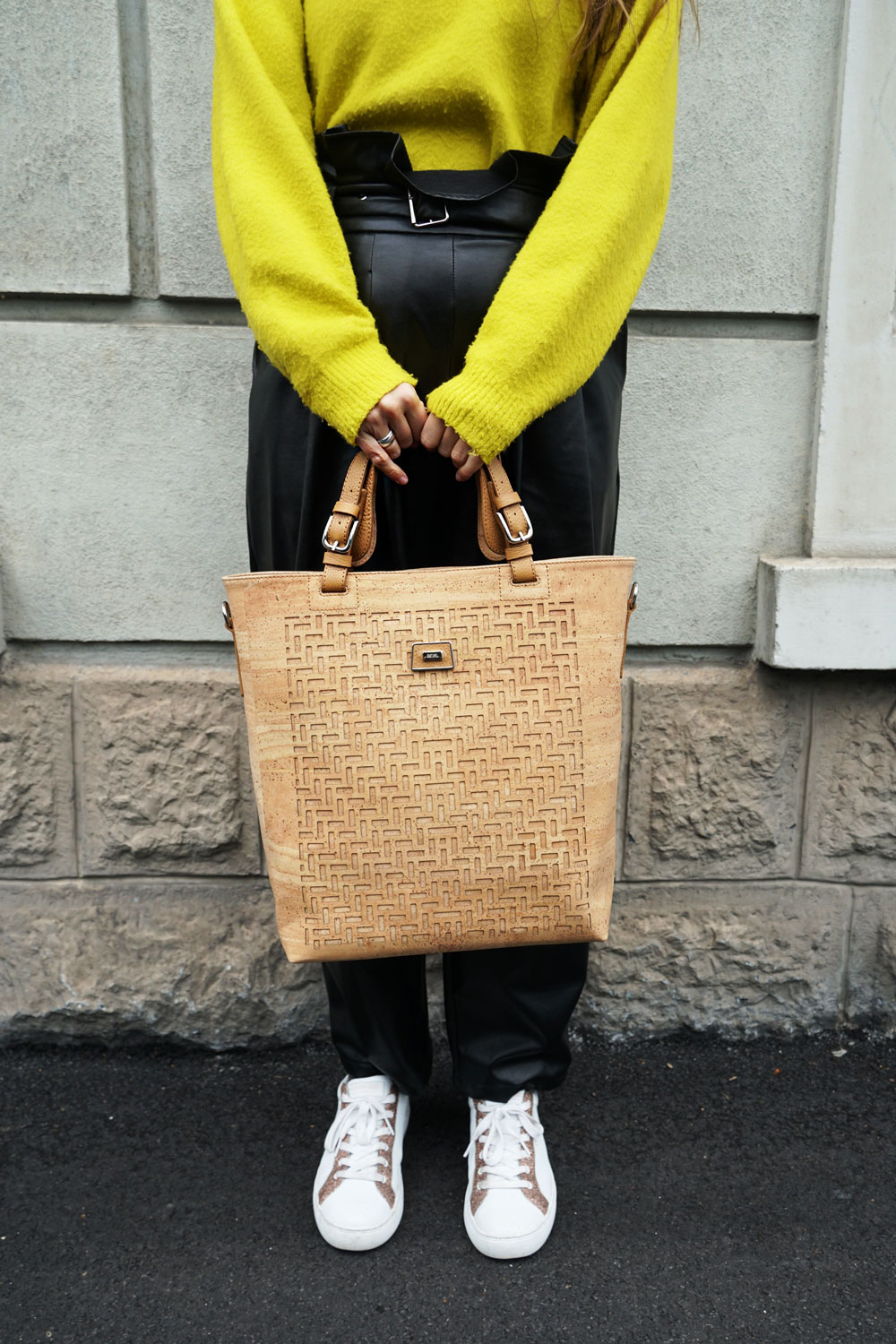 Andrea Steiner from sustainable fashion blog Strawberries 'n' Champagne based in Switzerland wears a cork bag by Korkeira.ch