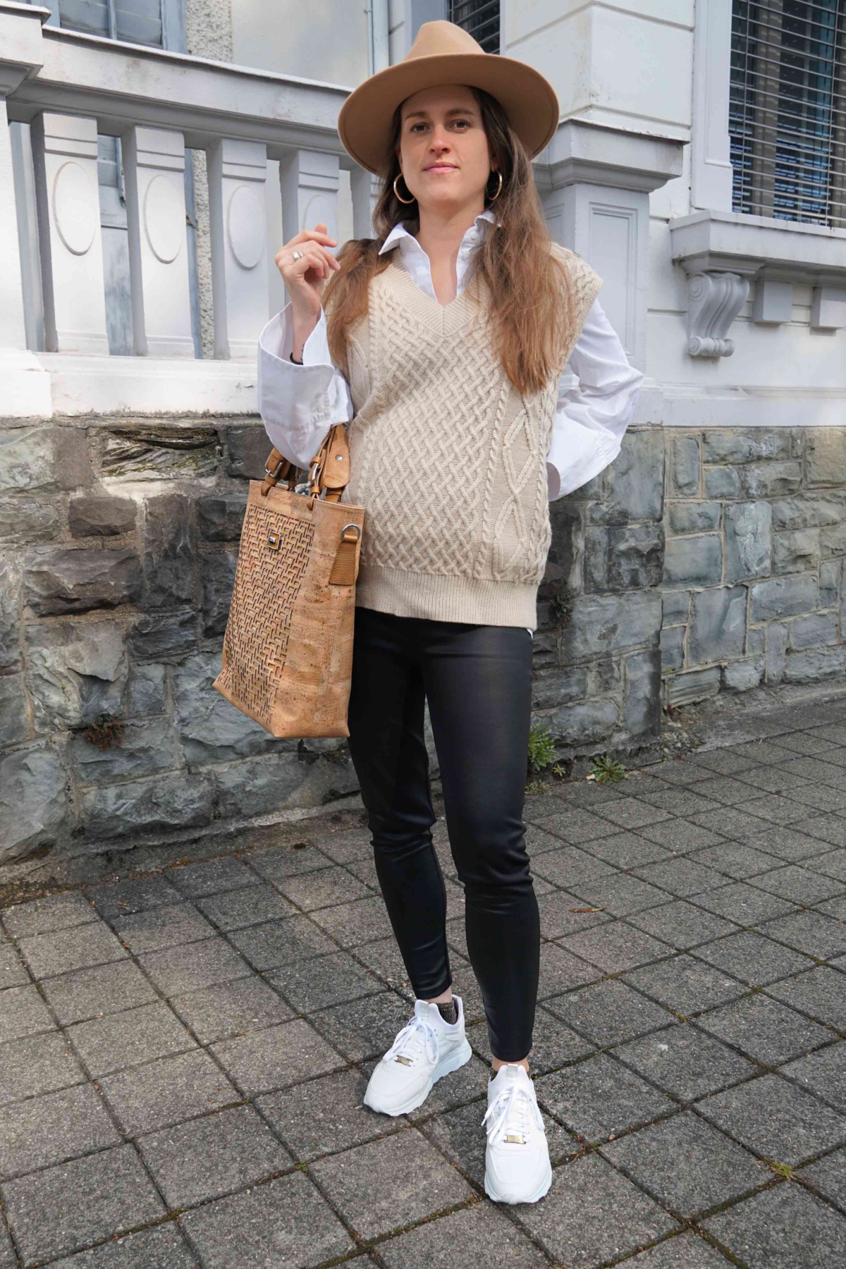 Andrea Steiner from sustainable fashion blog Strawberries 'n' Champagne wear the big trend: a knitted sweater vest and a blouse with balloon sleeves.