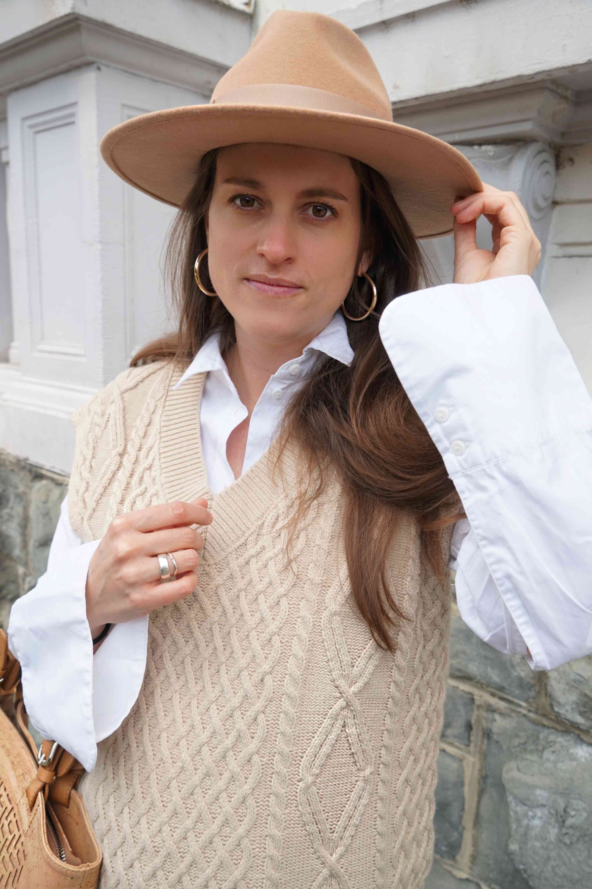 Andrea Steiner from sustainable fashion blog Strawberries 'n' Champagne wear the big trend: a knitted sweater vest and a blouse with balloon sleeves.